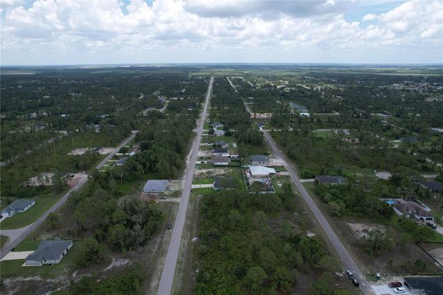 1056 JAGUAR BOULEVARD, Lehigh Acres, FL 33974