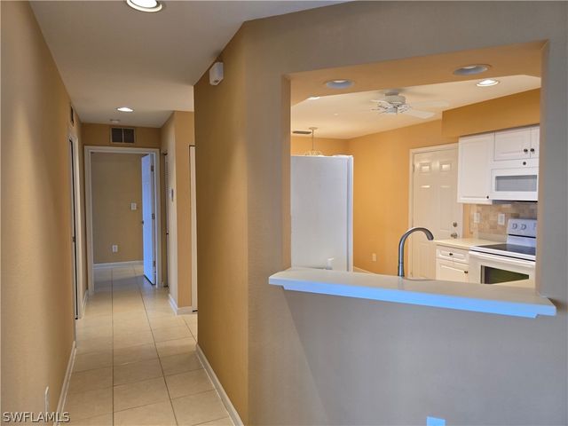 25069 Peacock LN 101, Naples, FL 34114