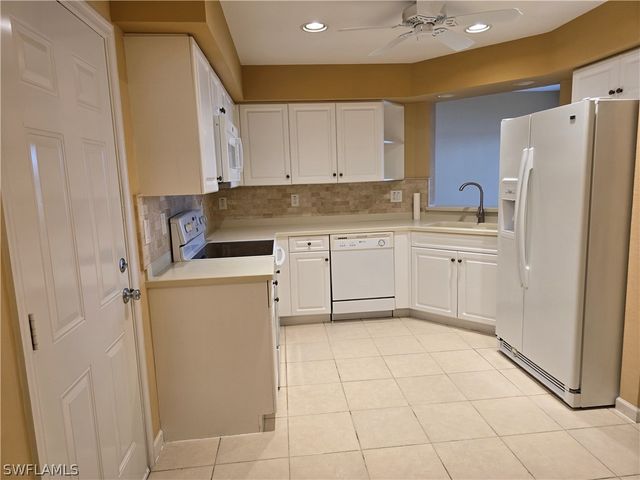 25069 Peacock LN 101, Naples, FL 34114