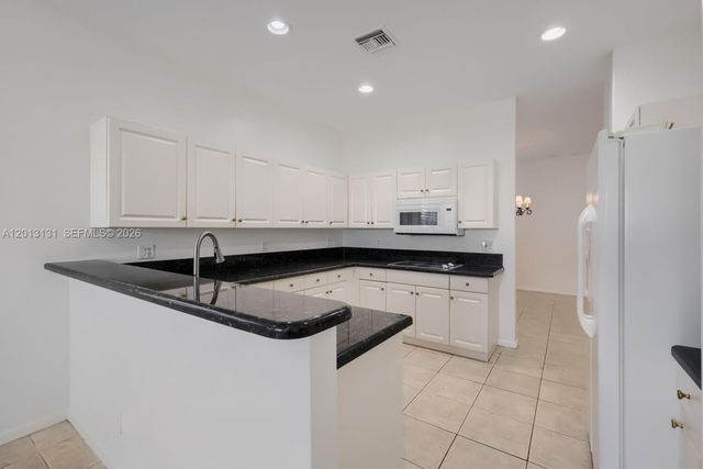 117 Palm Circle, Atlantis, FL 33462