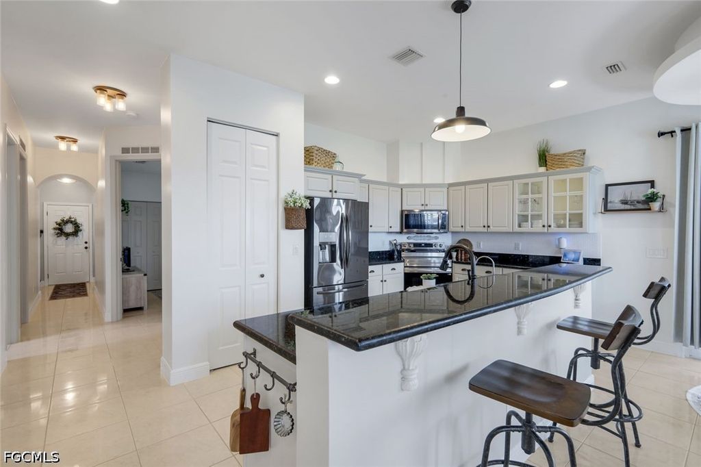 Image 11 of property listing at 1130 NW 14th TER, Cape Coral, FL 33993