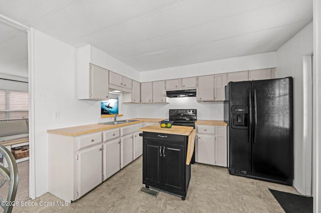 1103 Sabal Palm Lane, Barefoot Bay, FL 32976