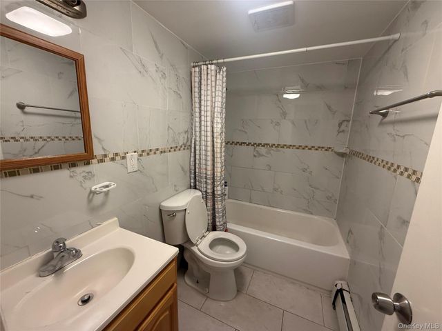 9309 103rd Avenue, Ozone Park, NY 11417
