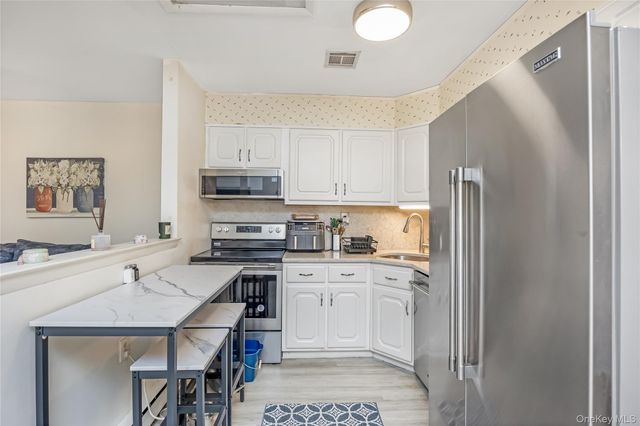 406 Woodbridge Drive B, Ridge, NY 11961