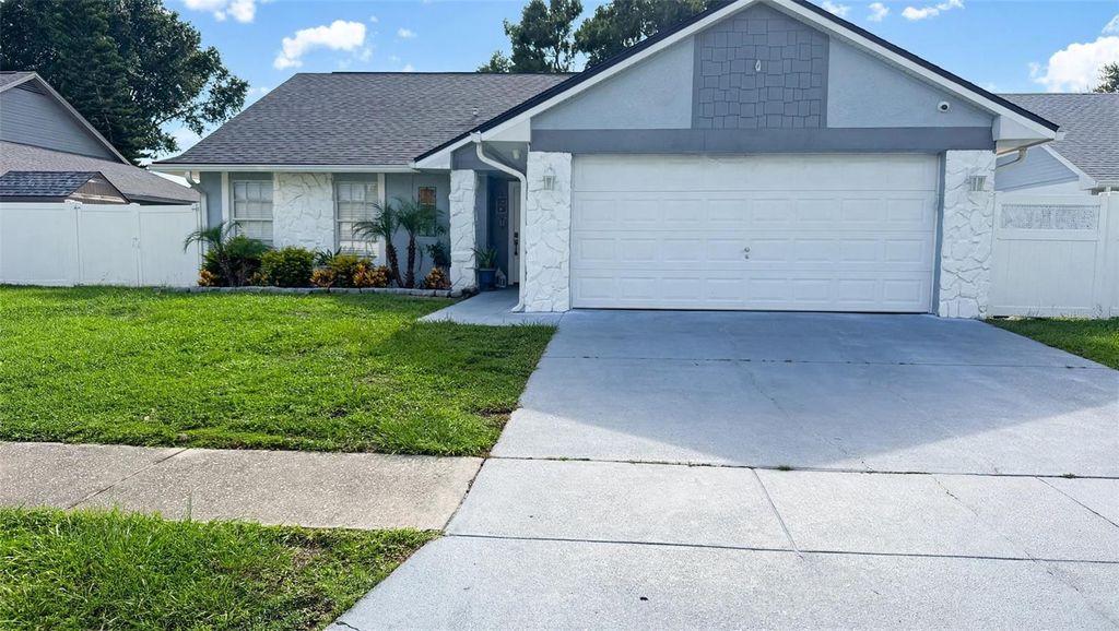 Image 1 of property listing at 7102 HOLLOWELL DRIVE, Tampa, FL 33634