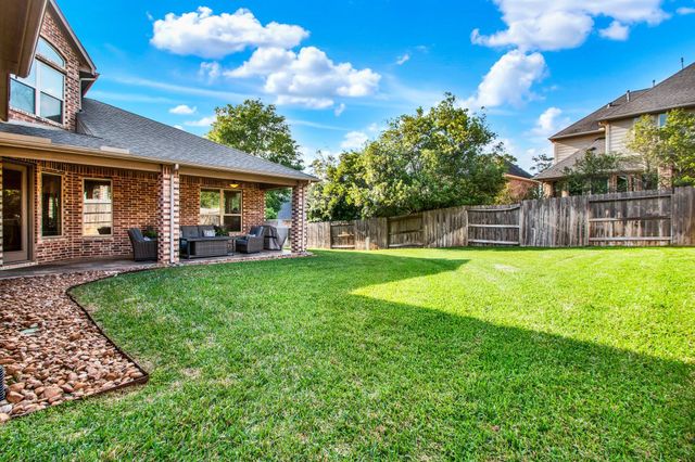 210 Chirping Squirrel Court, Pinehurst, TX 77362