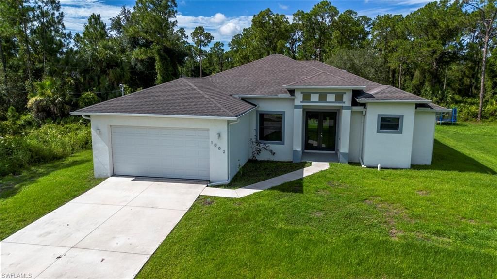 1002 E 5th ST, LEHIGH ACRES, FL 33972 — photo 2