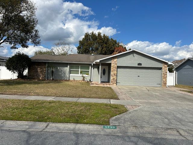 9739 POPLARWOOD COURT, Orlando, FL 32825