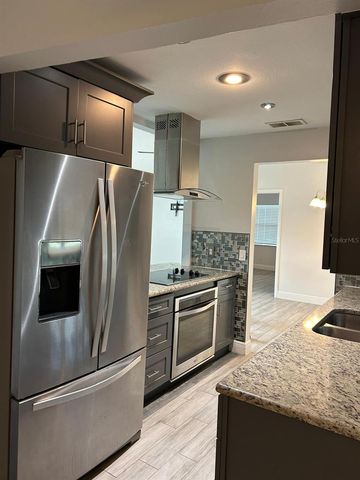 9739 POPLARWOOD COURT, Orlando, FL 32825