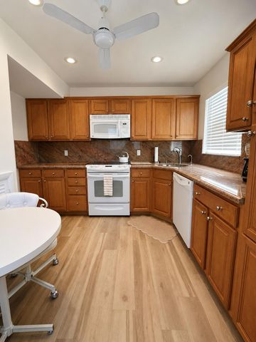 27 COLONIAL CLUB Drive 105, Boynton Beach, FL 33435