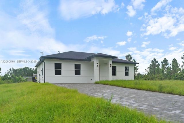 708 PEACOCK AVE, Lehigh Acres, FL 33974