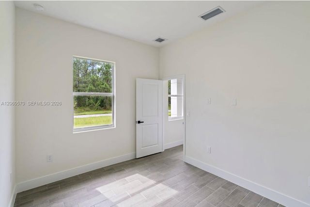 708 PEACOCK AVE, Lehigh Acres, FL 33974