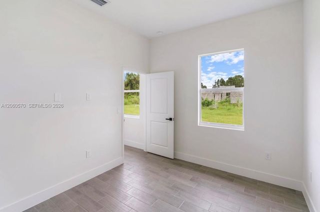 708 PEACOCK AVE, Lehigh Acres, FL 33974