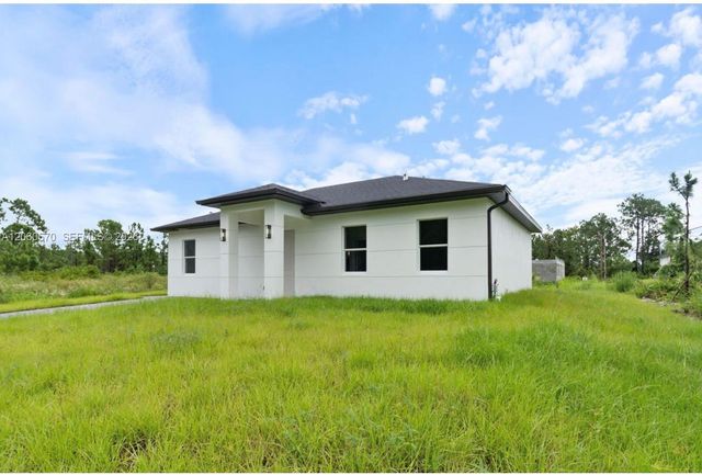 708 PEACOCK AVE, Lehigh Acres, FL 33974