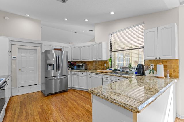 9055 Cypress Hollow Drive, Palm Beach Gardens, FL 33418