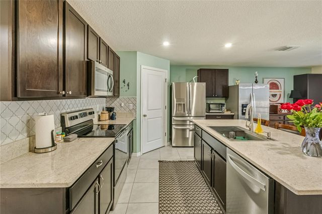 8669 TRIUMPH CIRCLE, Wildwood, FL 34785