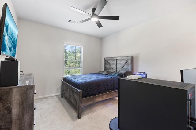 303 Calmato Woods Way, Willis, TX 77318