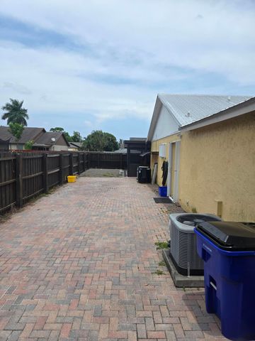 1402 Denlow Lane, Royal Palm Beach, FL 33411