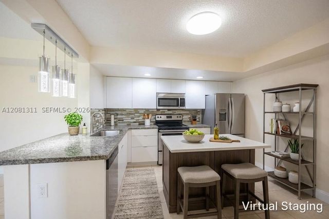 5681 Riverside Dr 105A6, Coral Springs, FL 33067
