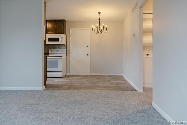 207 Neptune Drive, Walled Lake, MI 48390