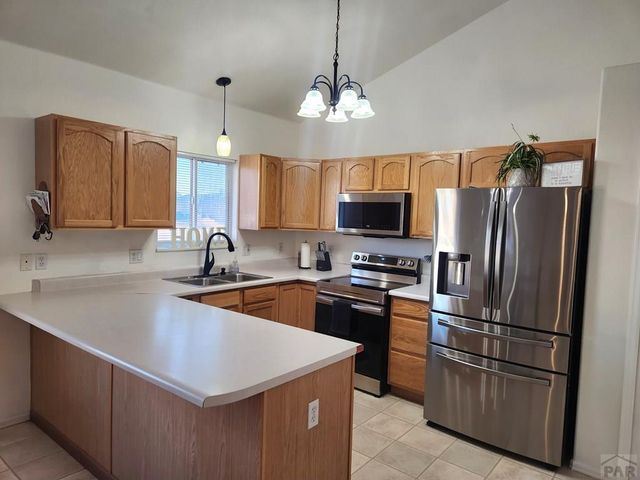 1467 W Plaza De Los Leones Dr, Pueblo West, CO 81007