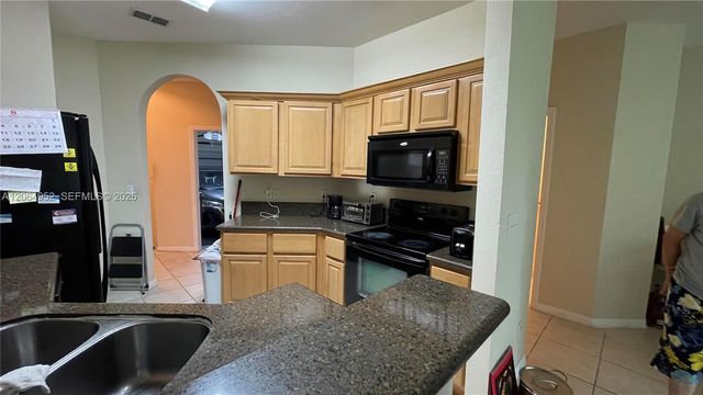 1015 Pipers Cay Dr, West Palm Beach, FL 33415