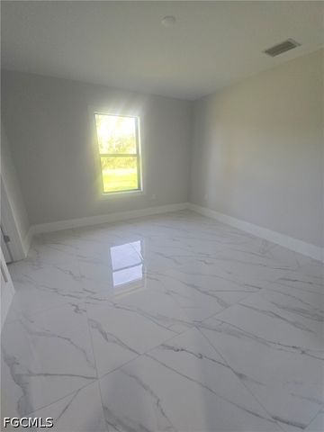 457 Woodman DR, Lehigh Acres, FL 33972