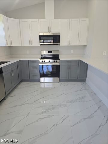 457 Woodman DR, Lehigh Acres, FL 33972