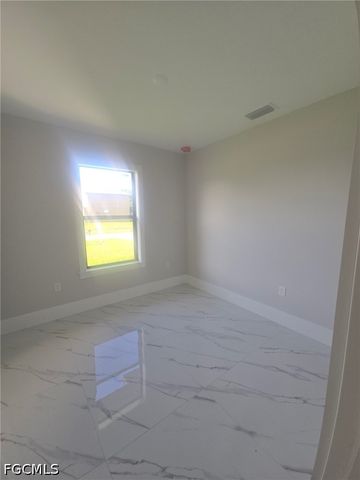 457 Woodman DR, Lehigh Acres, FL 33972