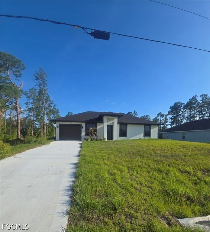457 Woodman DR, Lehigh Acres, FL 33972