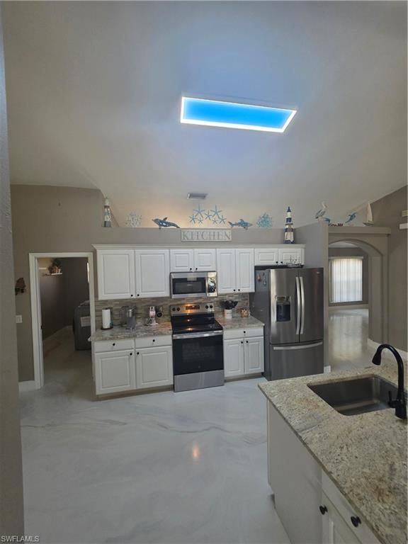 Image 12 of property listing at 410 NW 11th TER, Cape Coral, FL 33993