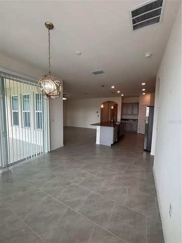 6930 AUDOBON OSPREY COVE, Harmony, FL 34773