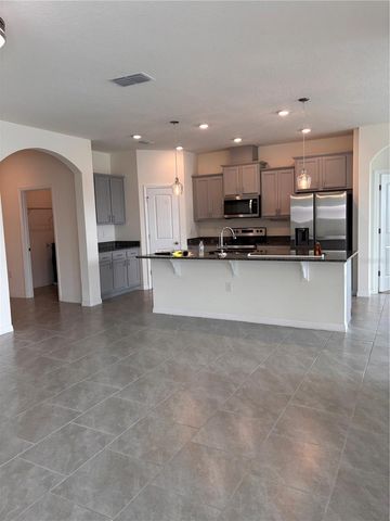 6930 AUDOBON OSPREY COVE, Harmony, FL 34773