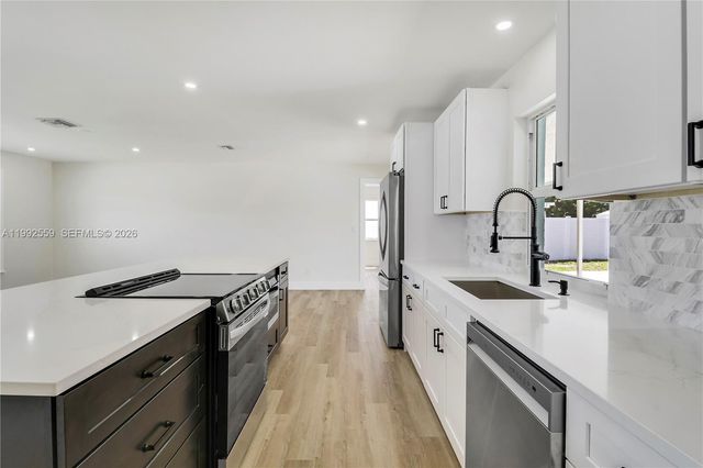 404 Highwood Circle, Jupiter, FL 33458
