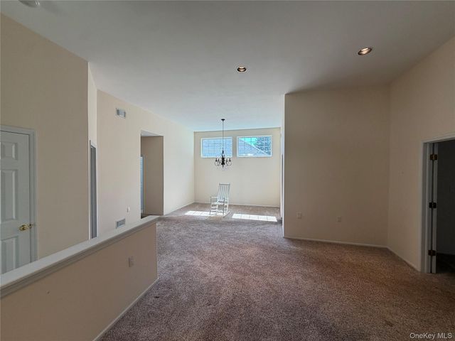 7 Sagaponack Court, Ridge, NY 11961