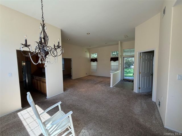 7 Sagaponack Court, Ridge, NY 11961