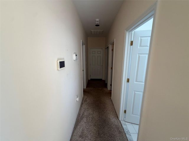 7 Sagaponack Court, Ridge, NY 11961