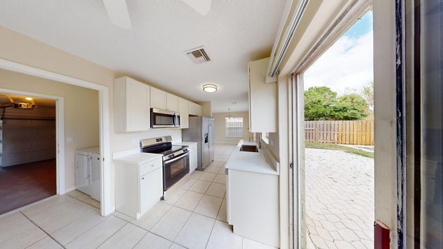 140 Pheasant Run Boulevard, West Palm Beach, FL 33415