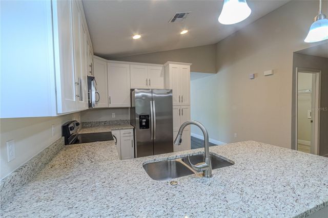 8593 PLUMERIA AVENUE, Orlando, FL 32825