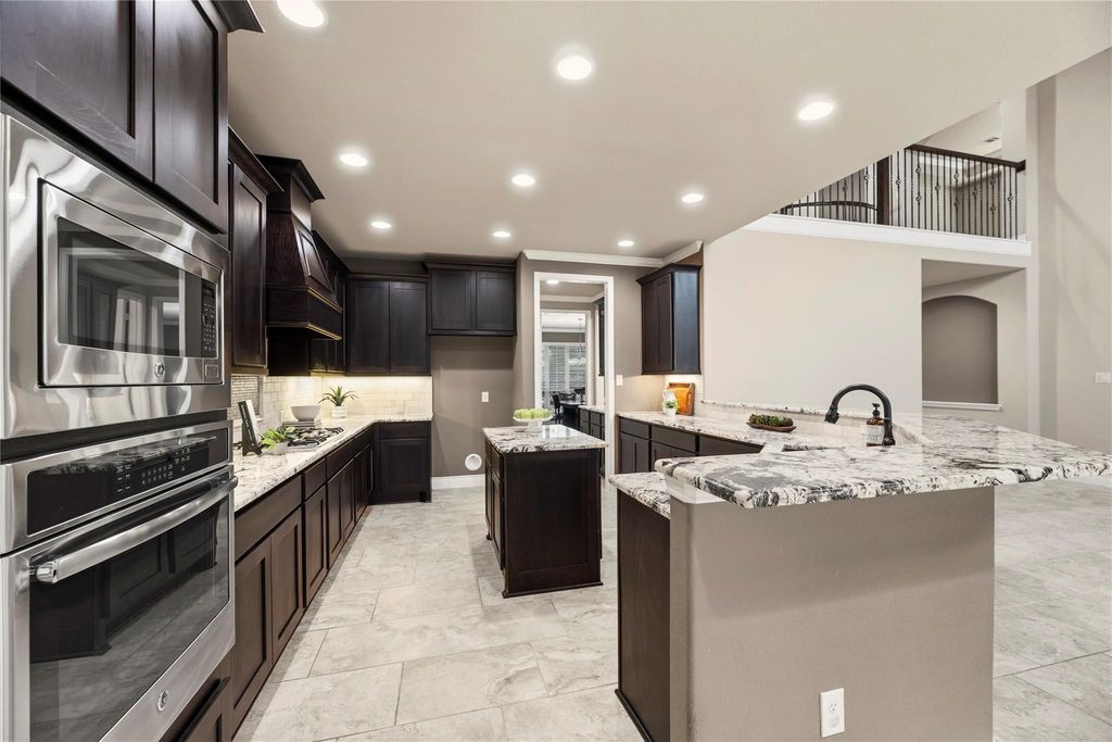 Image 11 of property listing at 10323 Millcreek Manor Lane, Cypress, TX 77433