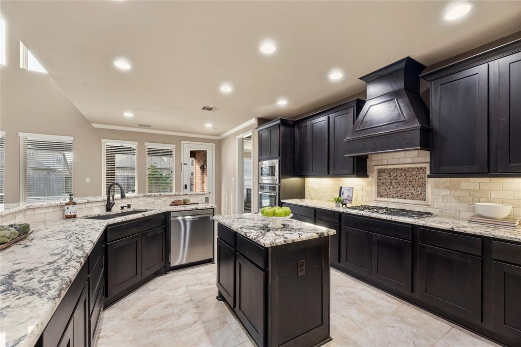 Image 13 of property listing at 10323 Millcreek Manor Lane, Cypress, TX 77433