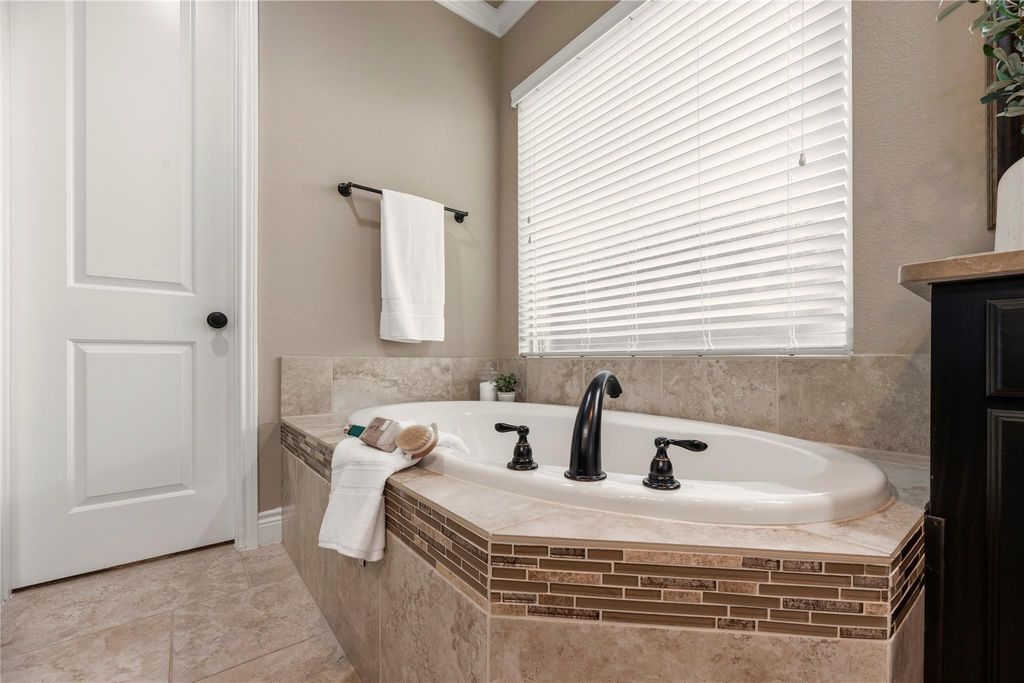 Image 23 of property listing at 10323 Millcreek Manor Lane, Cypress, TX 77433