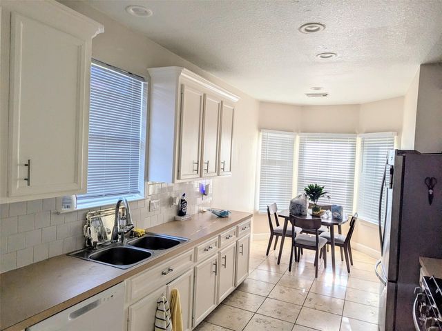 2402 Raintree Village Drive, Katy, TX 77449