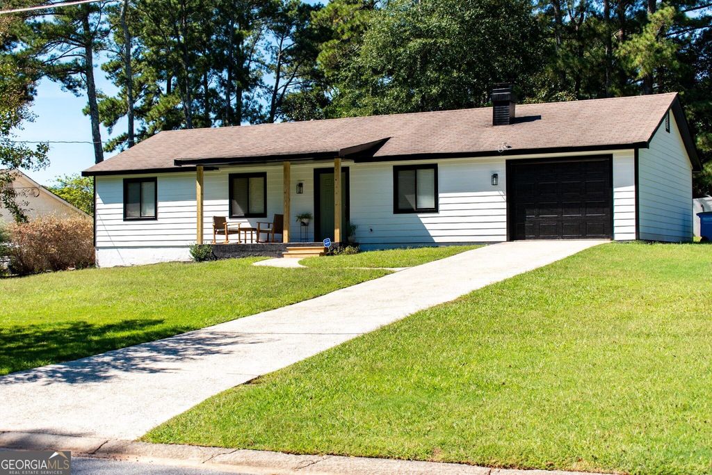 1077 Sawgrass Court SW, Lilburn, GA 30047 — exterior