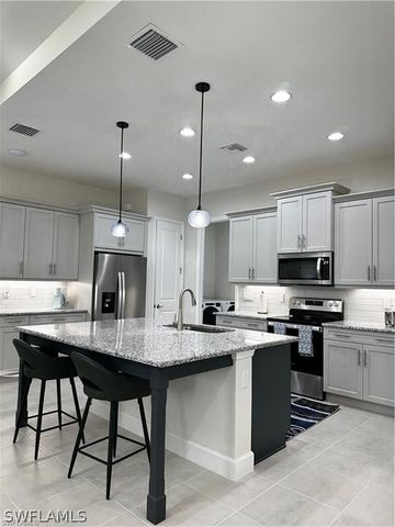 7135 Cayo Coco LN, Naples, FL 34113