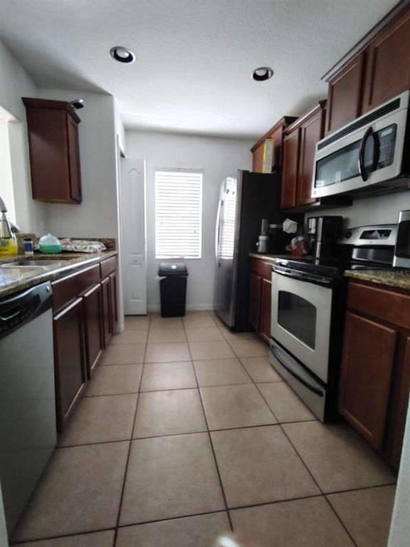 Image 4 of property listing at 9871 TRUMPET VINE LOOP, Trinity, FL 34655