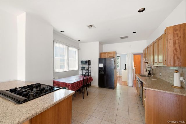 9725 91st Street, Ozone Park, NY 11416