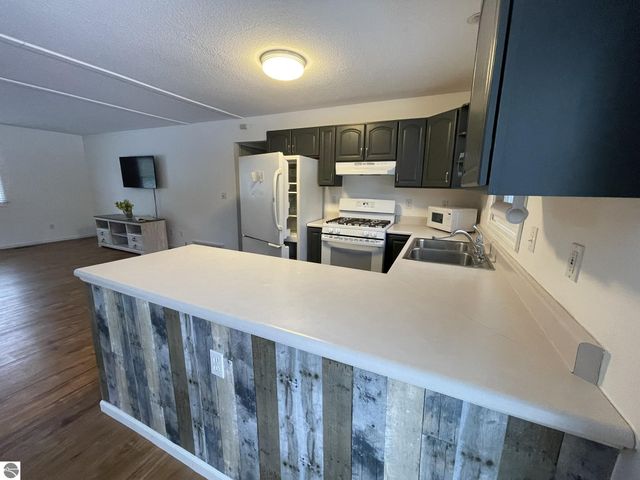 10511 Lake Of The Woods Road, Mancelona, MI 49659