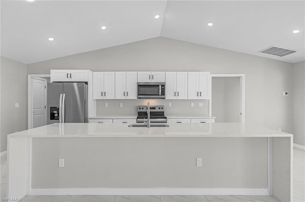 Image 6 of property listing at 1128 NW 9th TER, Cape Coral, FL 33993