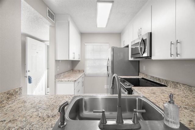 1438 MILLSTREAM LANE 102, Dunedin, FL 34698